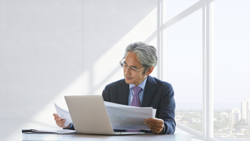 Business owner reviewing compliance requirements