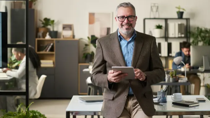 A business man holding a table