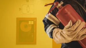 a man holding a fire extinguisher