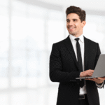 a businessman holding a laptop