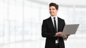 a businessman holding a laptop